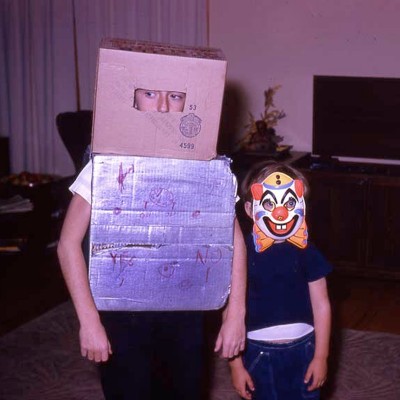 Ray proudly displaying his DIY robot costume for Halloween 1963