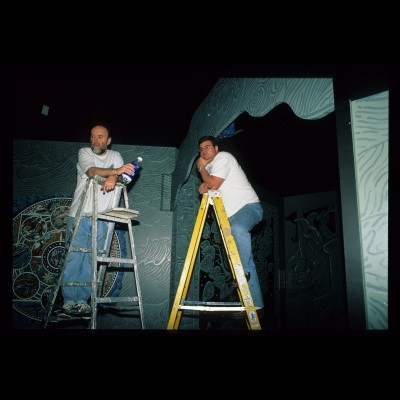 The artist and the scientist up on ladders figuring out their next move at the Denver Museum of Nature and Science in 1999.