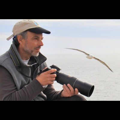 Carl with an albatross, who flies hundreds of miles to feed it's young. Photo by Pat Paladines