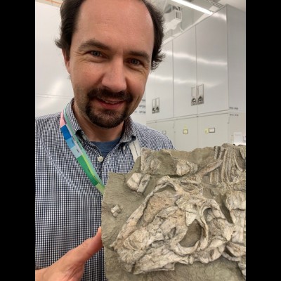 Christian with a cast of a Triassic aged Lystrosaurus collected in Antarctica.