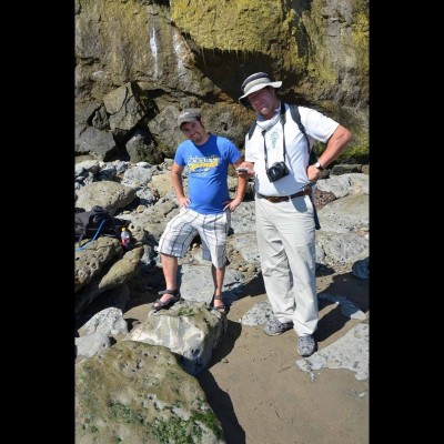 Standing by a fossil whale skull on a beach in Northern California.