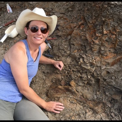 Holly with a hadrosaur (AKA duck-billed) humerus from the Hell Creek Formation.
&nbsp;