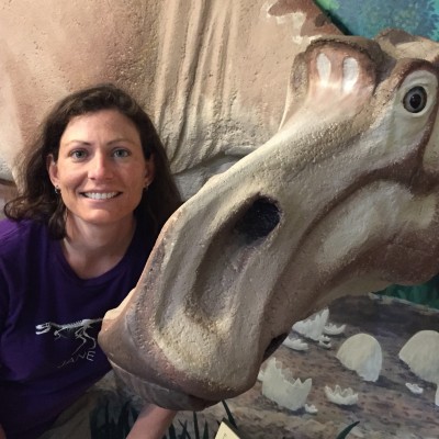 Holly with a Maiasaura sculpture in Choteau, MT