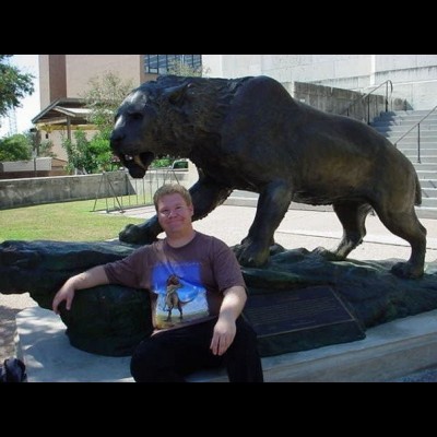 JP hanging out with the saber-toothed cat statue outside of the Texas Memorial Museum at the University of Texas in 2007.