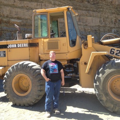Kinney Brick Quarry (KBQ) is a privately owned clay mine which uses the clays for industrial brick production. Here is JP posing with one of the heavy earth moving equipment used at the site in 2018.