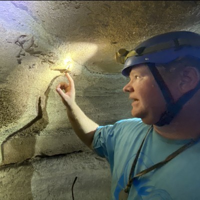 JP is checking out the Meckel&rsquo;s cartilage (lower jaw) and other cranial material of Saivodus striatus, a giant ctenacanth shark from the Late Mississippian period at Mammoth Cave National Park. (photo by Matt Cecil/NPS)