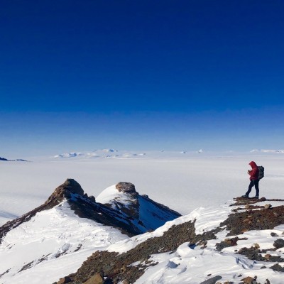 Neil surveys rocks atop Mt. Richie, above the ice of Skelton Neve, Antarctica, 2019.&nbsp; Can you believe these rocks hold the story a tropical world, millions of years in the past?