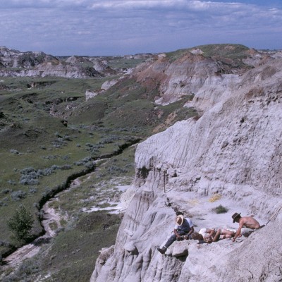 Sometimes you have to go to great lenghths to get to the bones. Check out this group of barve paleontologists digging on a Cretaceous bonebed outcrop in Alberta's Dinosaur Provincial Park. &copy; Louie Psihoyos 1994&nbsp;