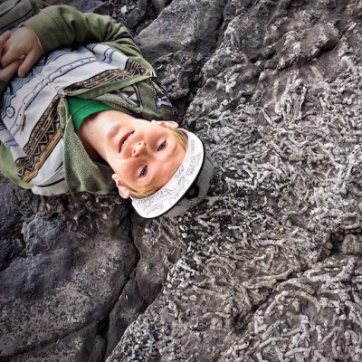 Carson posing with a fossil coral outcrop.