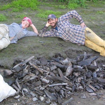 Grant and one of his faithful assistants, Elizabeth Hall with a collection of bones from the Old Crow River in 2006.