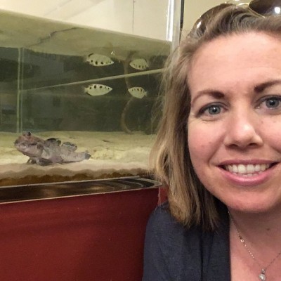 Laura with the mudskippers in one of the exhibits at the Sternberg Museum of Natural History.