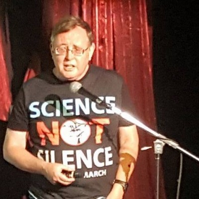 Don lecturing to CFI Hollywood on science deniers, wearing his T-shirt from the 2017 March for Science