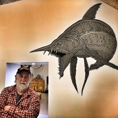 Ray strikes a pose between his two giant wall paintings of a Xiphactinus and a Protosphyraena.