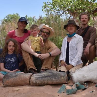Working with her family, and colleagues Matt Wedel and Brian Engh on a late Jurassic sauropod femur found by Paige Wiren (center) in 2018.
