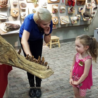 Ashley and Lee giving a young dinosaur fan their first look at a cast Tyrannosaurus rex jaw. Gotta start 'em young!