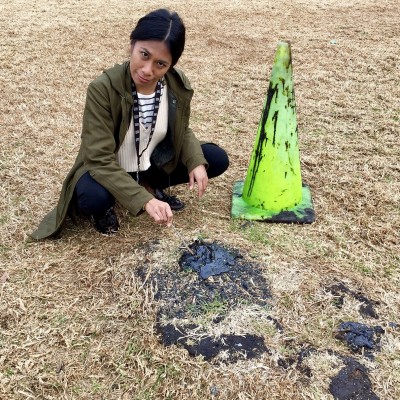 Poking asphalt "tar" just outside the La Brea Tar Pits (don't do this at home or when you visit the Tar Pits!)