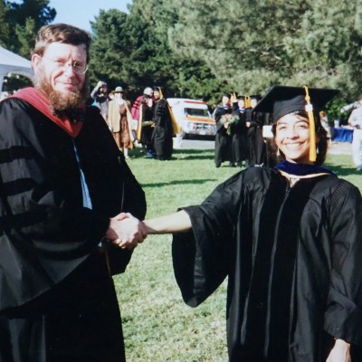 Newly minted Ph.D. Chin shakes hands with her graduate advisor, Dr. Bruce Tiffney, a paleobotanist.&nbsp;