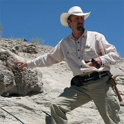 Scott in the Hanksville-Burpee Dinosaur Quarry in Wayne County, Utah. Source: NPS