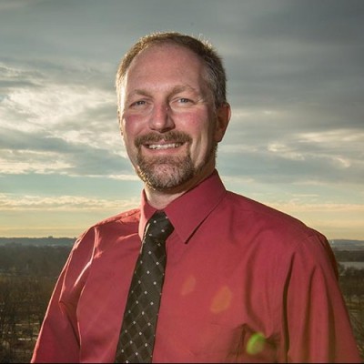 Scott on the rooftop of the Stewart Lee Udall Department of the Interior Building before the BLM relocated to New Mexico (Photo: John Froschauer/PLU)