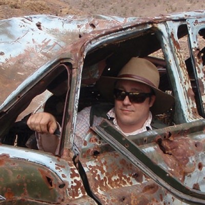 Ken getting up close and personal with an oxidized (AKA rusted) automobile, a close comparison (at least in color and process) to the surface of Mars. Image source: JPL