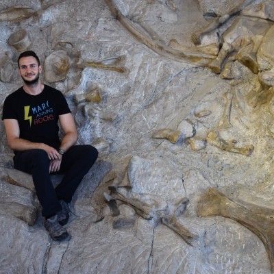 Examining numerous dinosaur bones at Dinosaur National Monument. 2019.