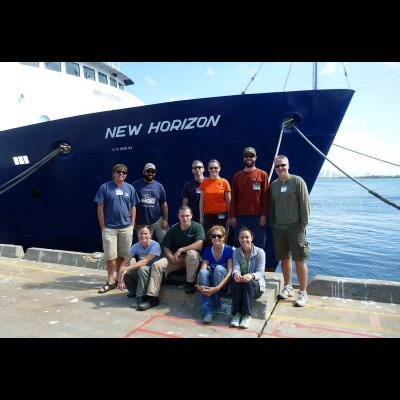 Kelly and collaborators on the dock after a research expedition.