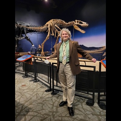 Tom Holtz at the Burpee Museum of Natural History in Rockford, Illinois. The teenage T. rex behind him is nicknamed "Jane". A few holdouts in the paleo world still believe that "Jane" was an adult Nanotyrannus. For more about this specimen go to https://fossil.fandom.com/wiki/Jane_(dinosaur)