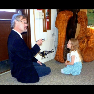 Russell giving a tibia lecture to a rapt young visitor to the Tate Geological Museum in Casper.