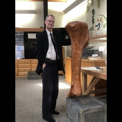 Russell striking a dignified pose next to a fine femur at the Tate.