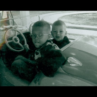 A very young John Gurche with his brother Charles in a bumper car way back in the day.