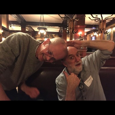 Ray Troll and Mike Coates proudly displaying their polished chrome domes upon meeting at a bar in Chicago circa 2016.