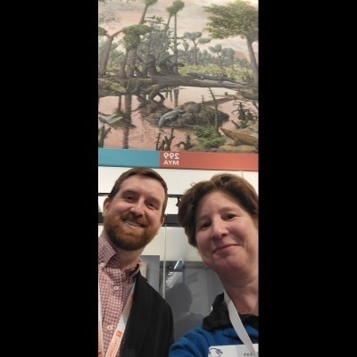 Susan posing with Ray's nephew Joe Rynasko in front of the Zalinger mural.