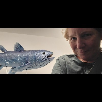 A coelacanth model and Susan in her favorite hidden nook in the newly remodeled Peabody Museum. Most adults miss it, but if you are child-sized, it's superb!