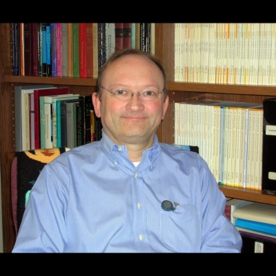 A happy looking Hans in his book lined office&nbsp;