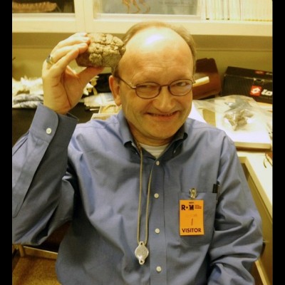 Hans Sues with a cast of Hansuessia, a genus of dome headed Pachycephalosaurid dinodsaur named in his honor.