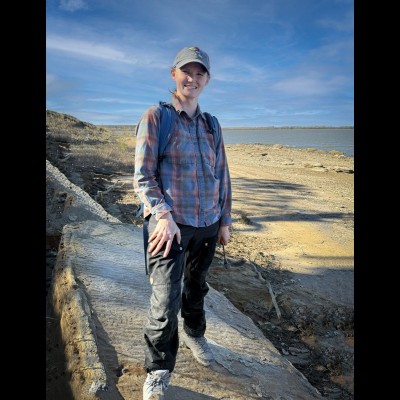 Kate standing on ancient wave ripples of a Cretaceous shore