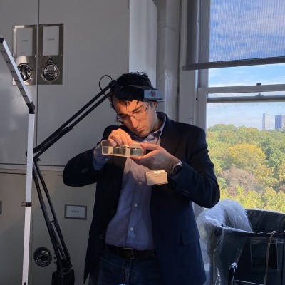 James Napoli inspecting a fossil the old fashioned way