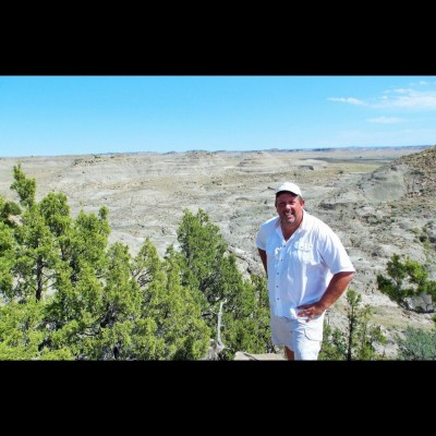 Scott high on a hill overlooking a fine stretch of the Hell Creek Formation.