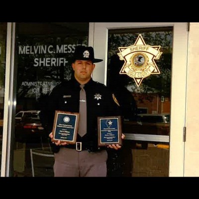 Here's Scott in 1997 when he was a Deputy Sheriff graduating from the Law Enforcement Academy holding two awards: Academic Achievement & Illinois Sheriff’s Association Outstanding Officer Award.