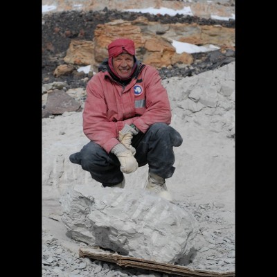 Phil Currie behind the largest block of Cryolophosaurus that he helped to excavate on Bill Hammer’s expedition to Antarctica in 2010-2011. Photo by Eva Koppelhus, 2011